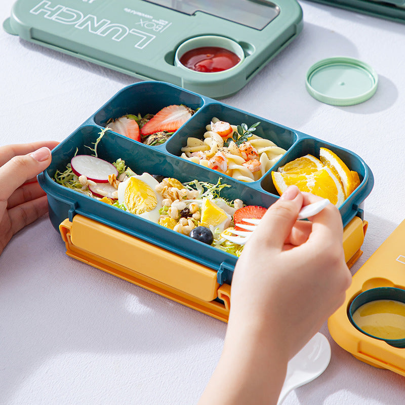 Microwaveable sealed lunch box with compartments and sauce box with cutlery